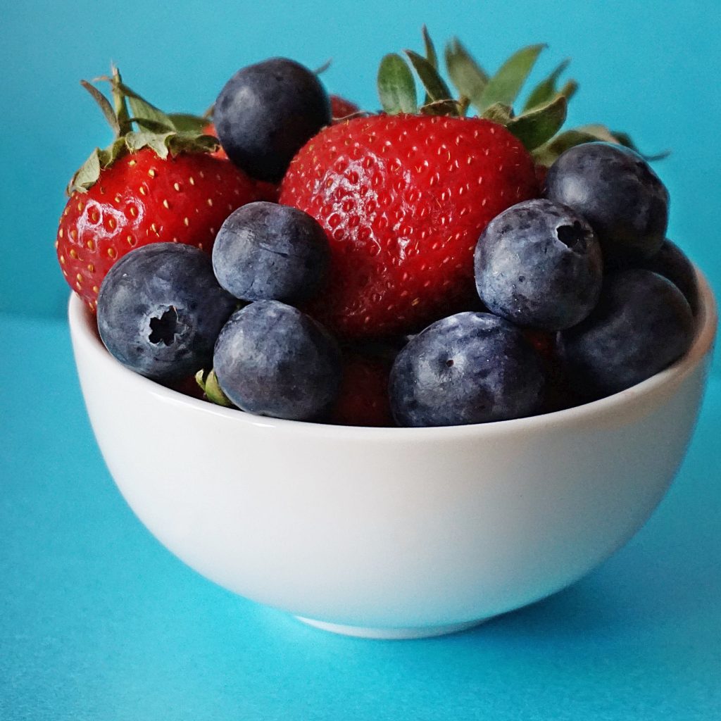 Blueberries and Strawberries in White Ceramic Bowl